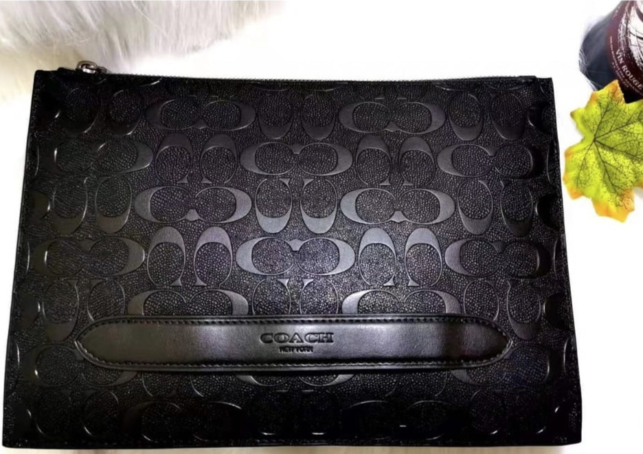 produk TAS PRIA COACH EMBOSSED CLUTCH
